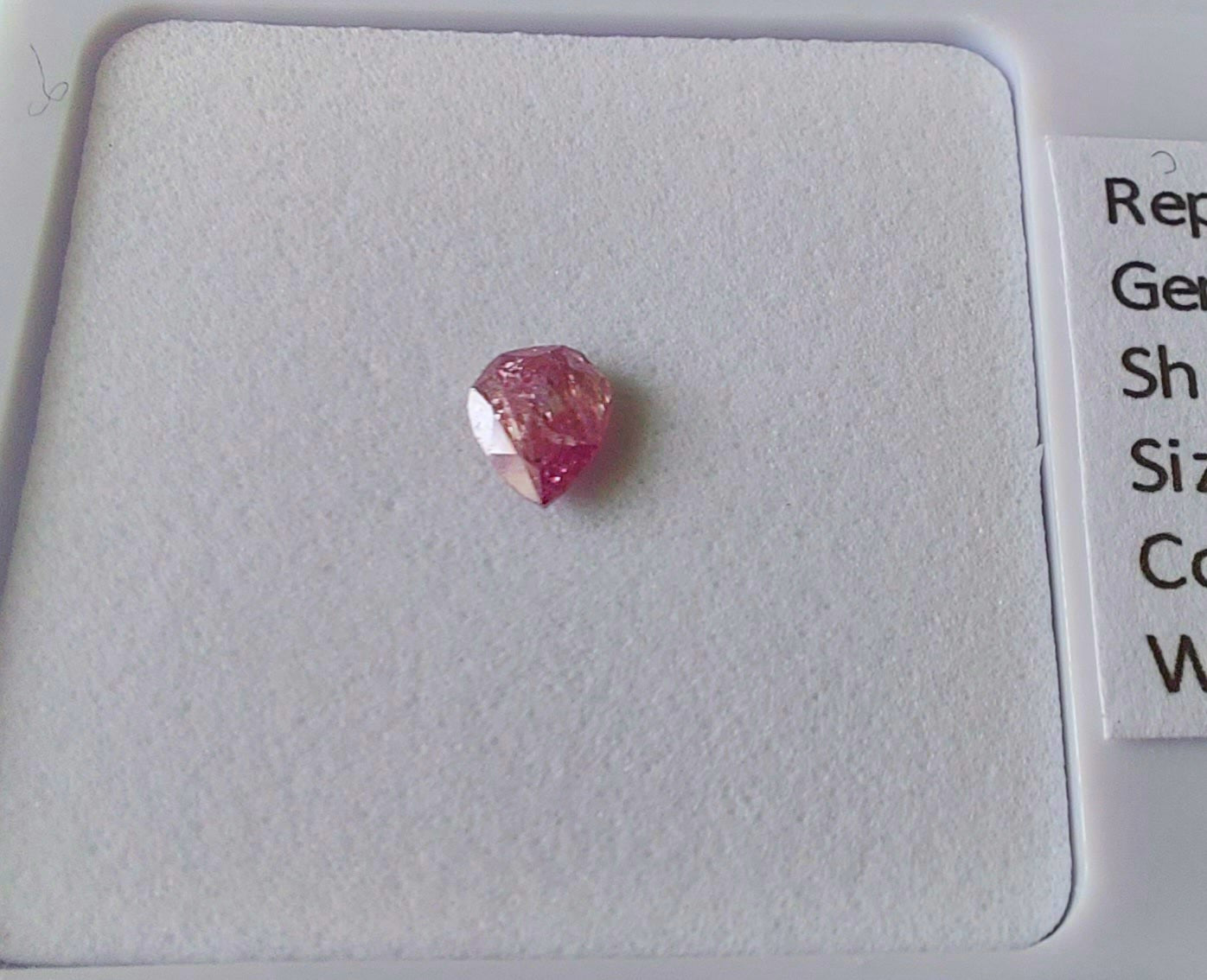 0.13 Fancy Vivid Pink Diamond